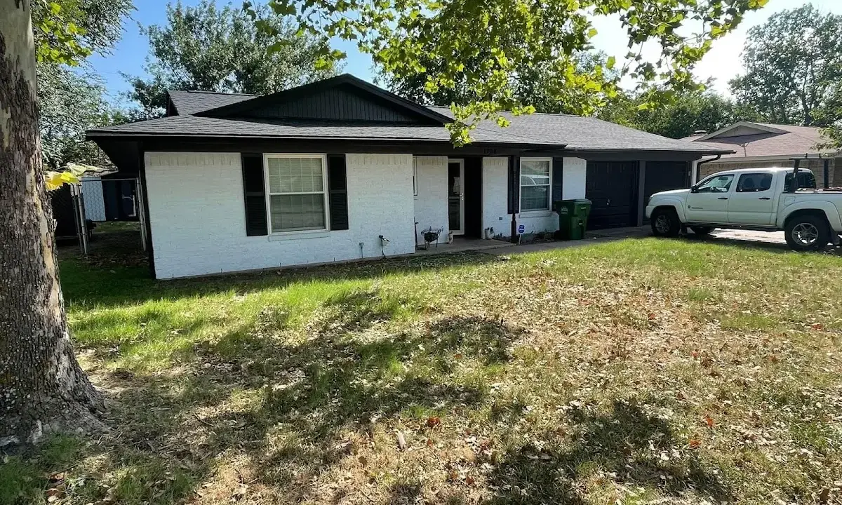 Professional roofing crew working on a residential roof in River Forest